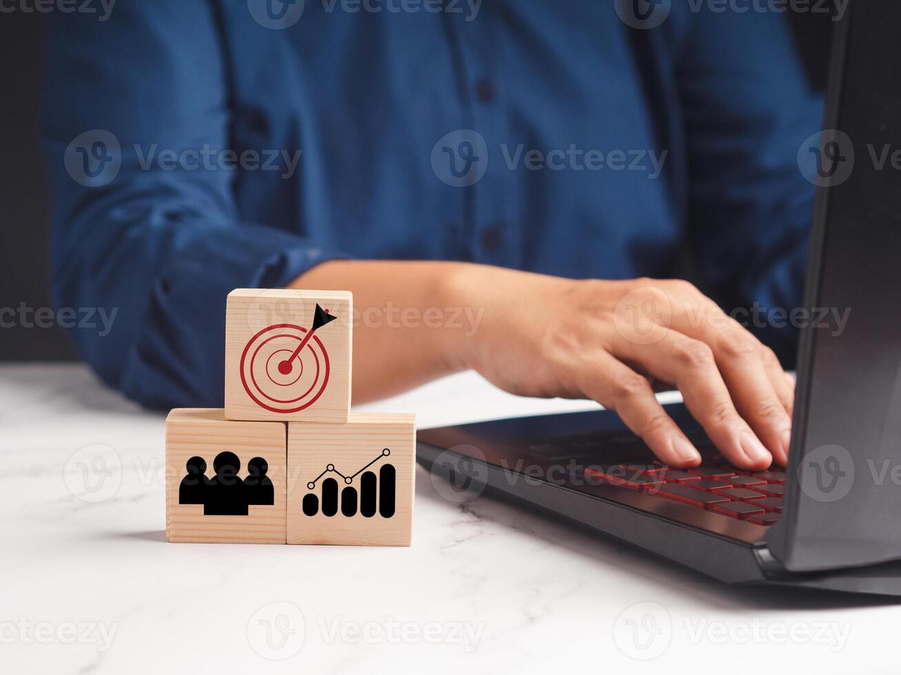 Wooden cubes with icon business strategy and businessman working at the office photo