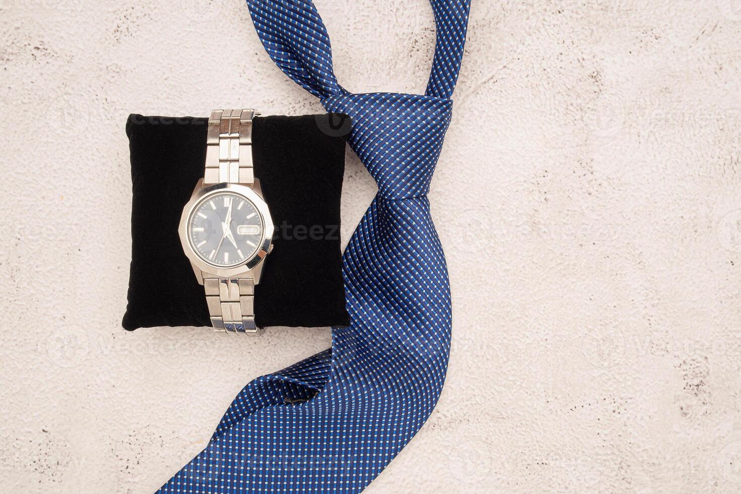 Happy Father's Day concept. A men's watch on black velvet and necktie over a table photo