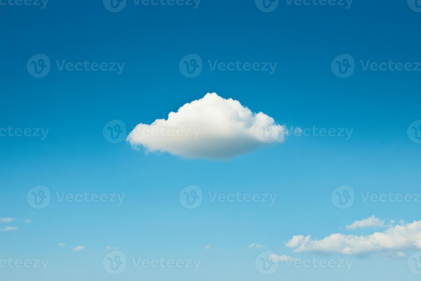 Fluffy White Cloud Against a Clear Blue Sky Captured on a Sunny Day photo
