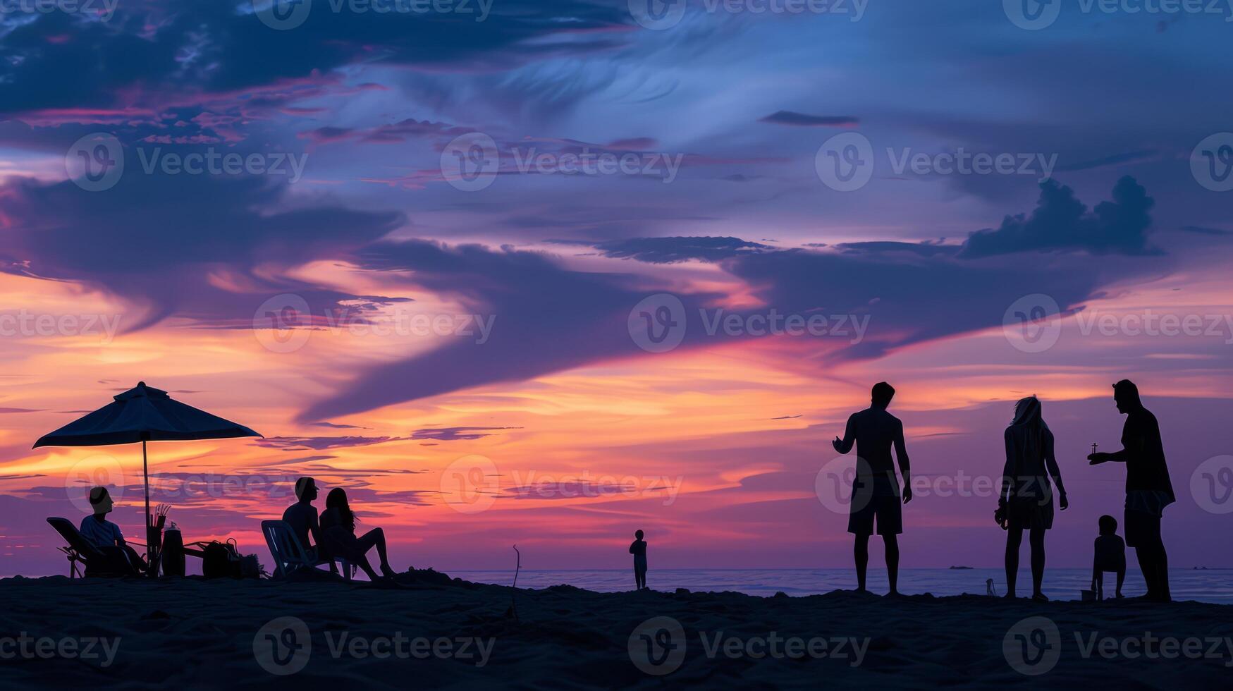 Beach holiday captured in striking silhouette against the vibrant evening sky photo