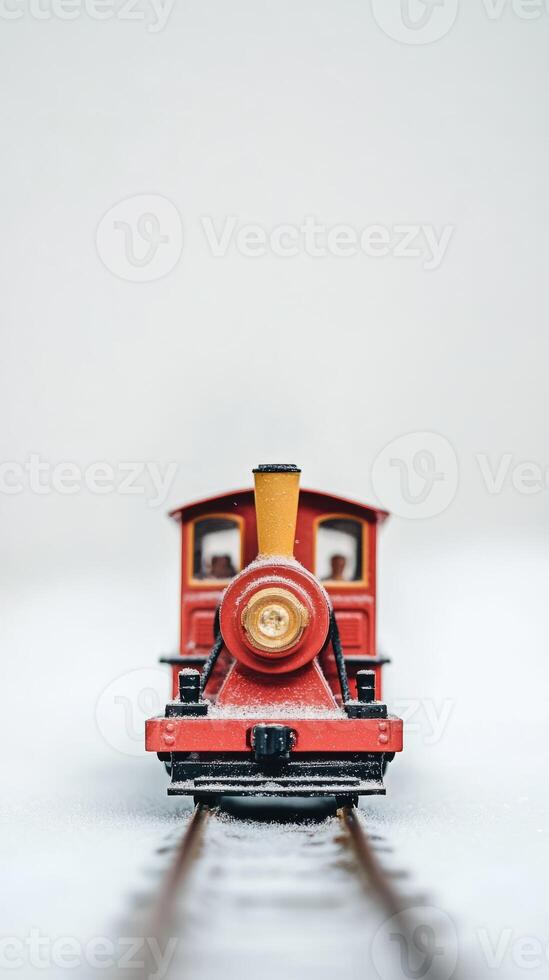 A red train with a yellow smoke stack photo