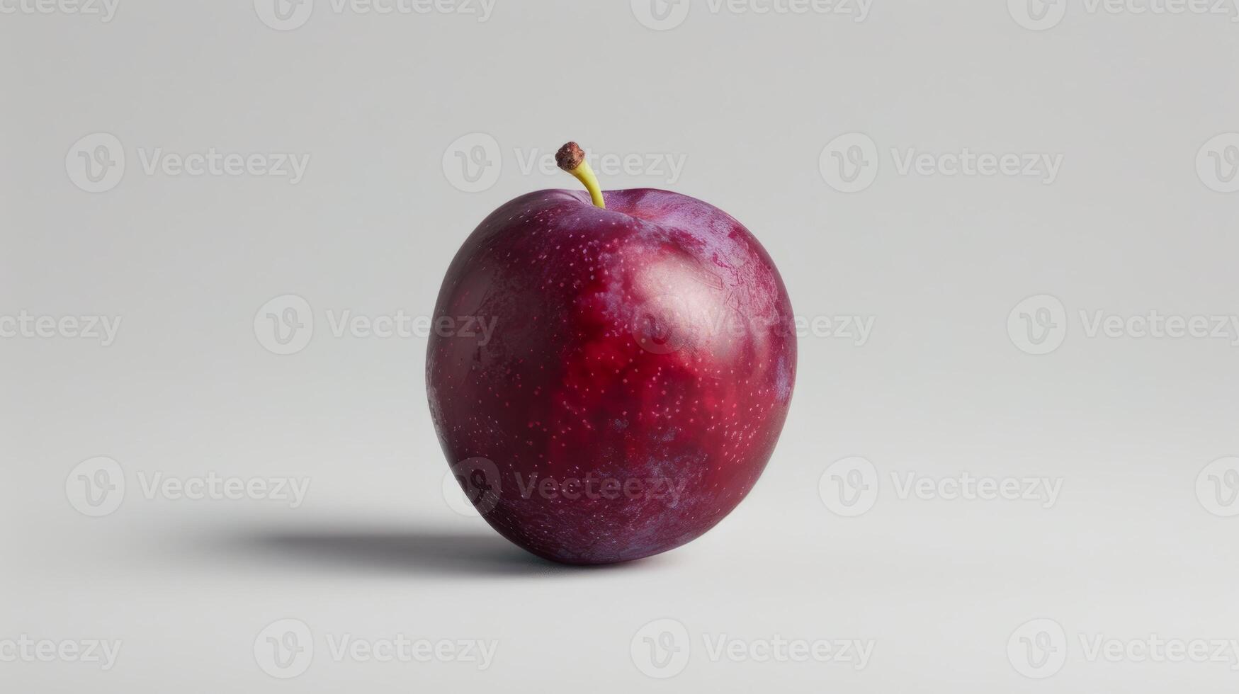 Minimalist concept with a single plum on a white background photo