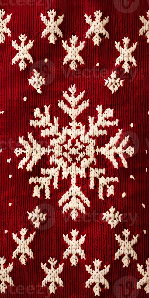 A red and white knitted snowflake pattern photo