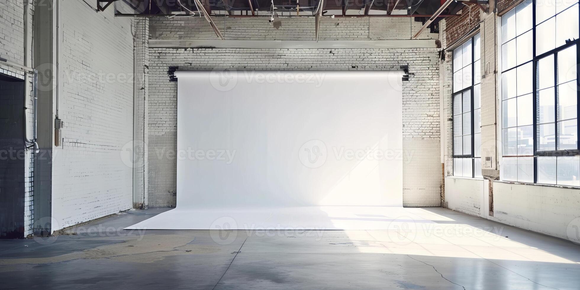 Spacious Industrial Loft Studio with Large Windows and White Backdrop photo