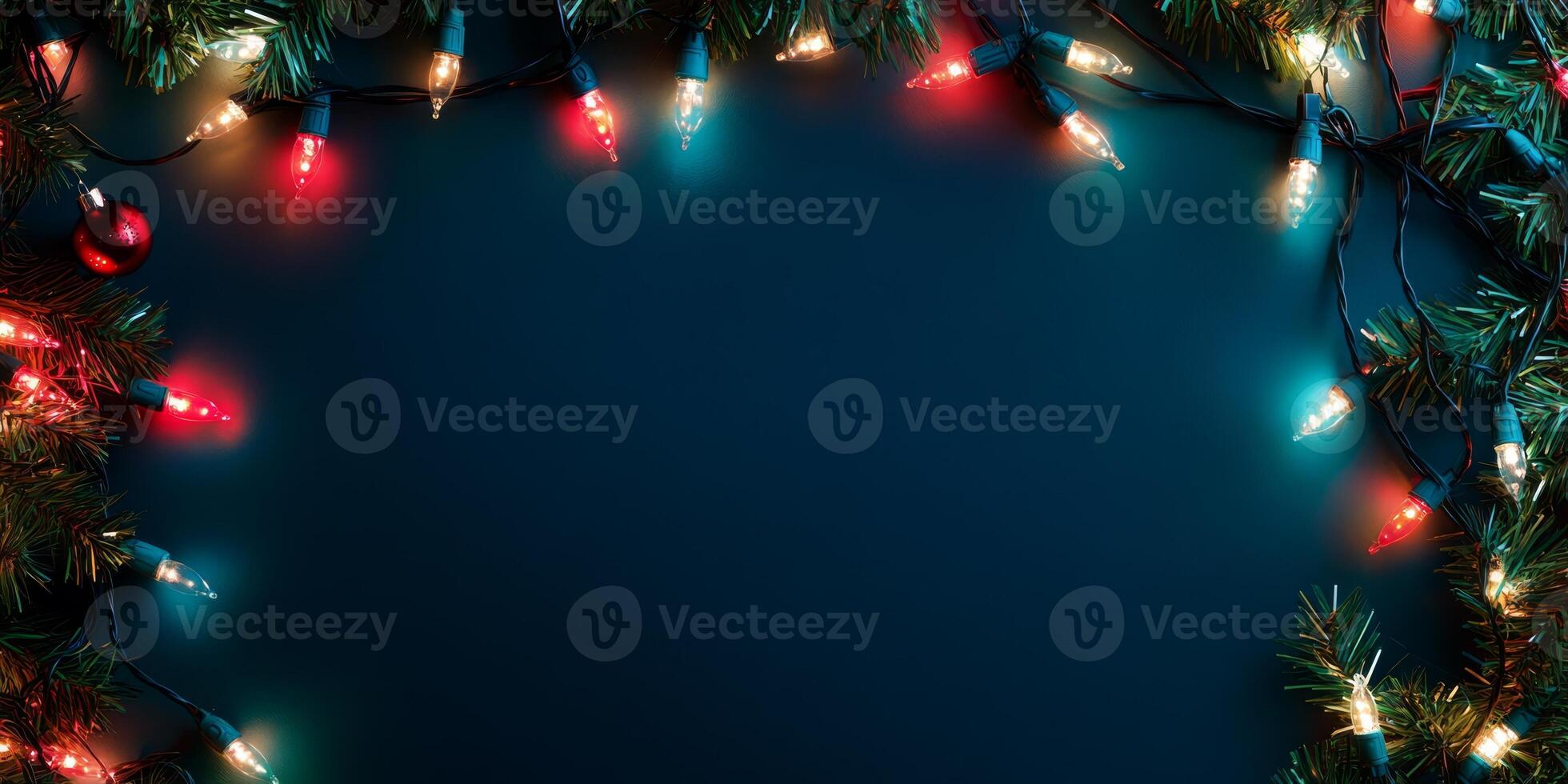 Festive Christmas Lights and Greenery Border on Dark Background for Holiday Celebrations photo