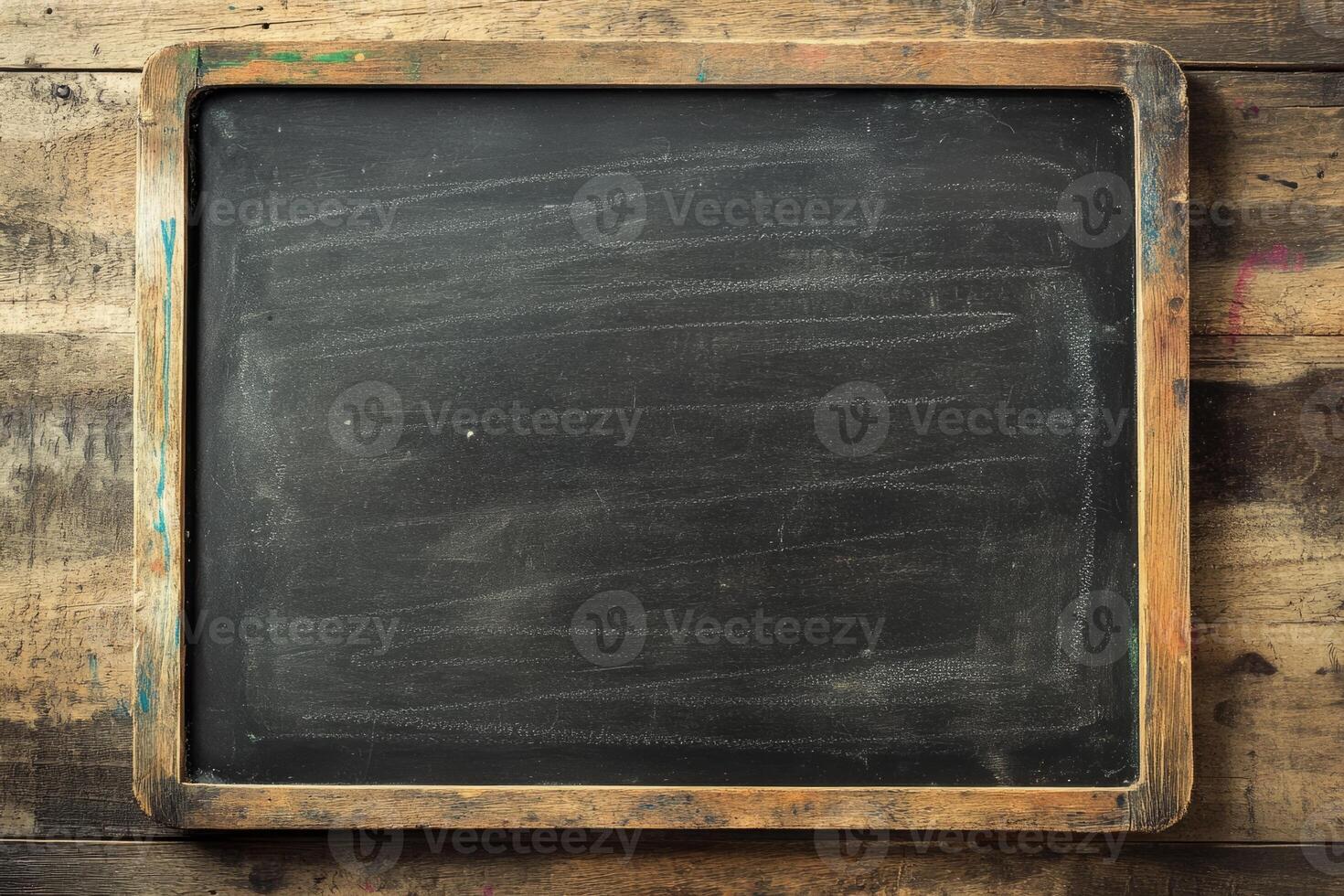 Rustic Vintage Chalkboard on Wooden Tabletop with Textured Background photo