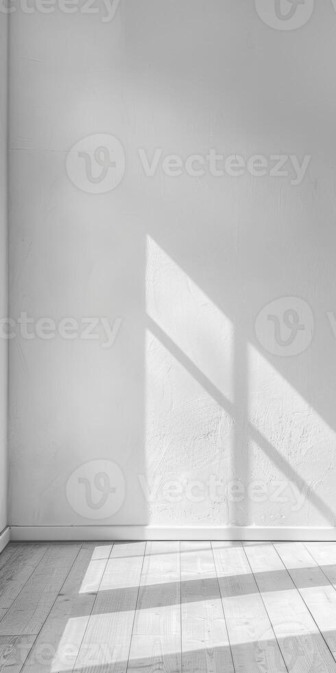 Plain white wall providing a straightforward and pristine canvas for photography. photo