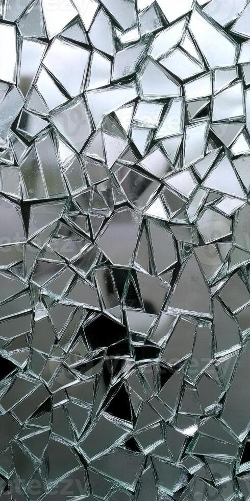 A glass window with a lot of broken pieces photo
