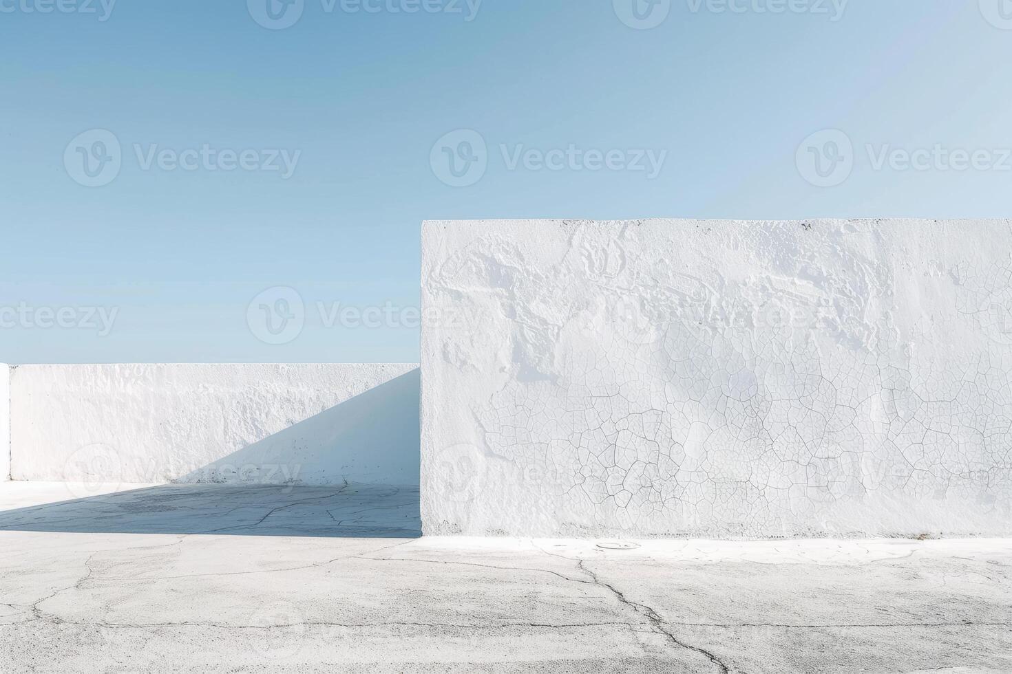 Simple white wall offering a versatile and pristine background for photography. photo