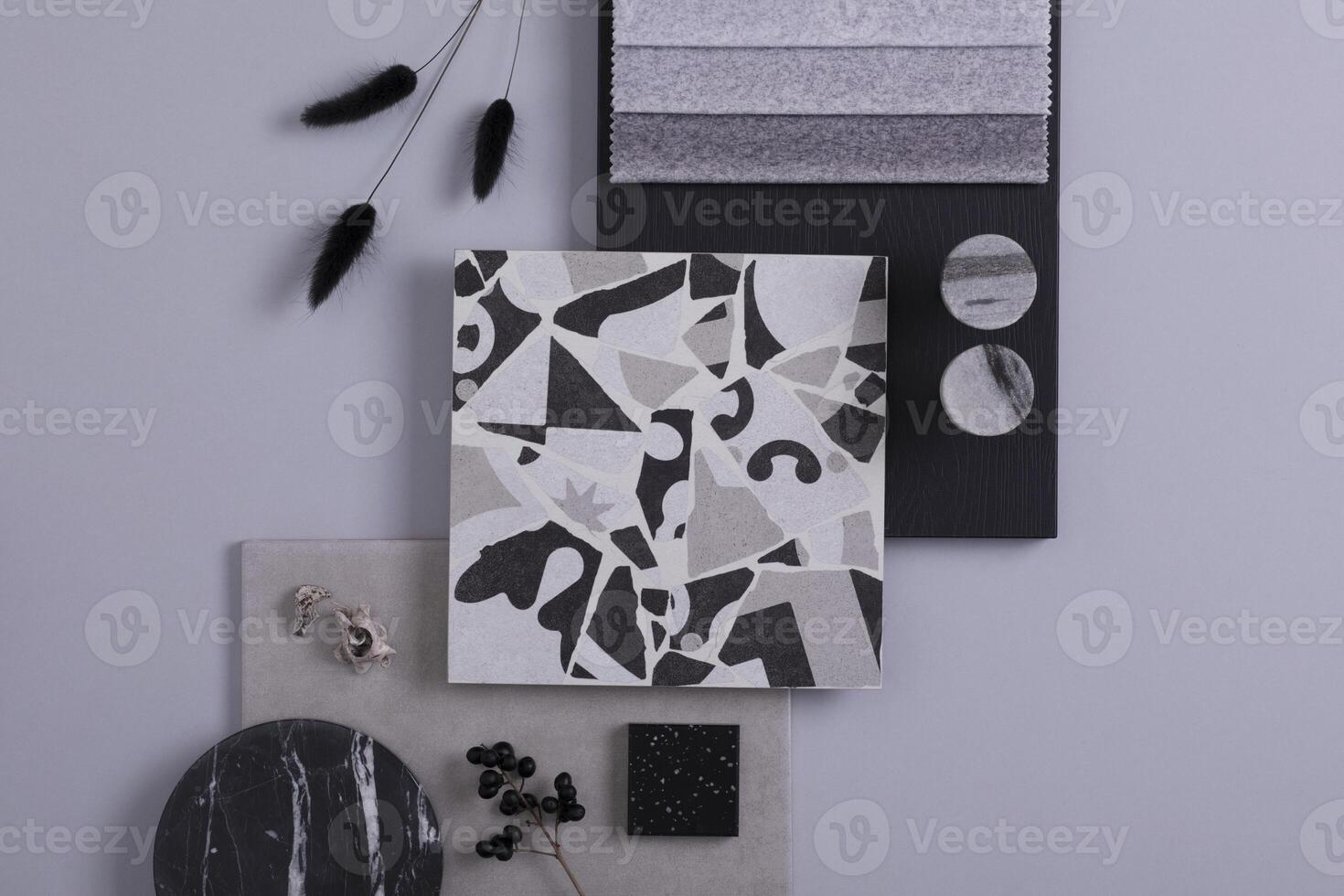 Creative flat lay composition in grey and black color palette with textile and paint samples, panels and lastrico tile. Architect and interior designer moodboard. Top view. Copy space. Template. photo