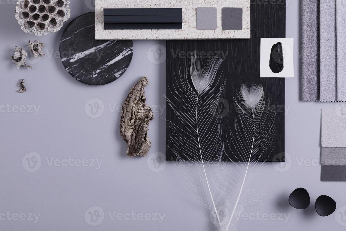 Creative flat lay composition in grey and black color palette with textile and paint samples, panels and tiles. Architect and interior designer moodboard. Top view. Copy space. Template. photo