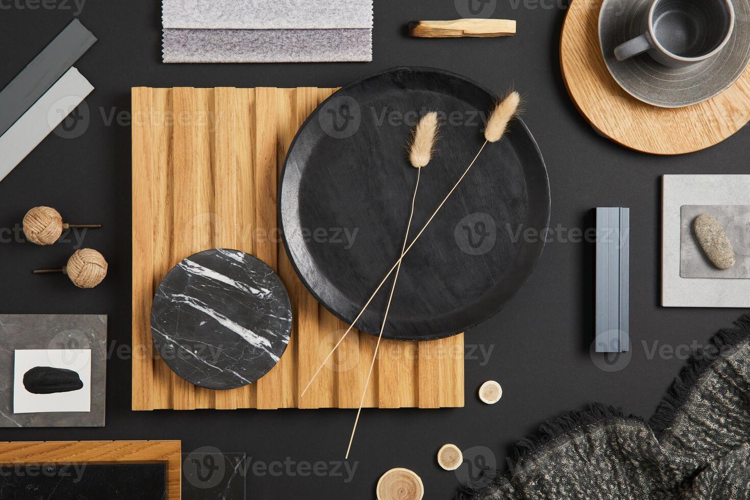 Stylish flat lay comosition of creative architect moodboard with black, beige and grey samples of textile, paint, wooden lamella panels and marble tiles. Top view. Copy space. Template. photo