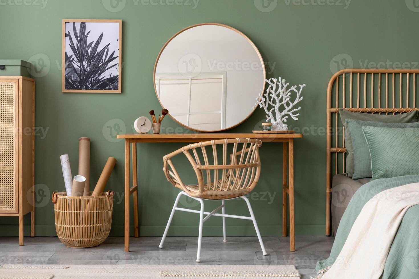 Elegant details of modern interior design with wooden sideboard, bed, mirror, painting and stylish personal accessories. Green wall. Mock up poster. Template. photo