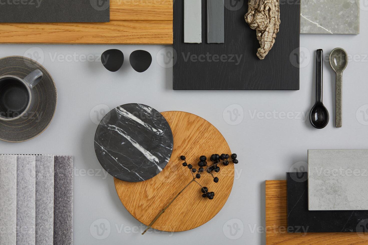 Elegant architect moodboard flat lay composition in light grey, black and brown color palette with textile and paint samples, wooden panels and marble tile. Top view. Copy space. Template. photo