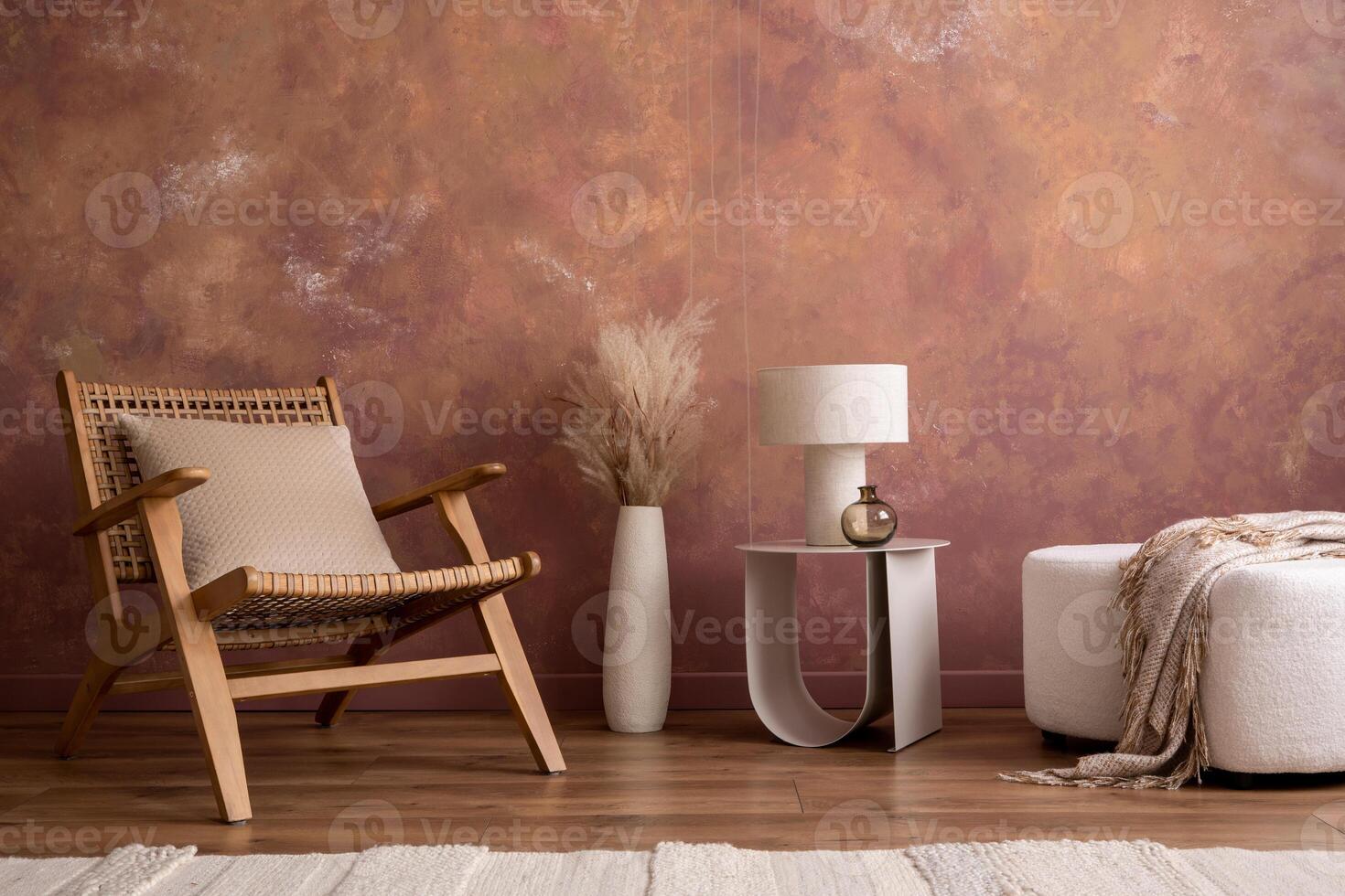 Minimalist composition of elegant and outstanding space with rattan armchair, modern pouf, design coffee table, lamp, vase and elegant accessories. Home decor. Template. photo