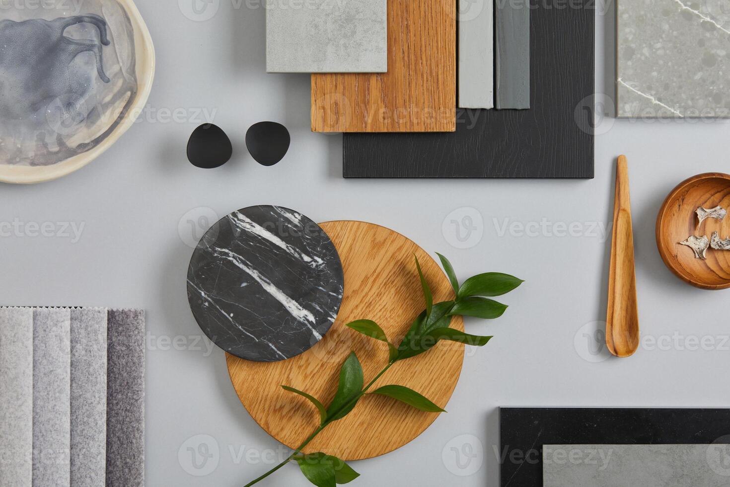 Elegant architect moodboard flat lay composition in light grey, black and brown color palette with textile and paint samples, wooden panels and marble tile. Top view. Copy space. Template. photo