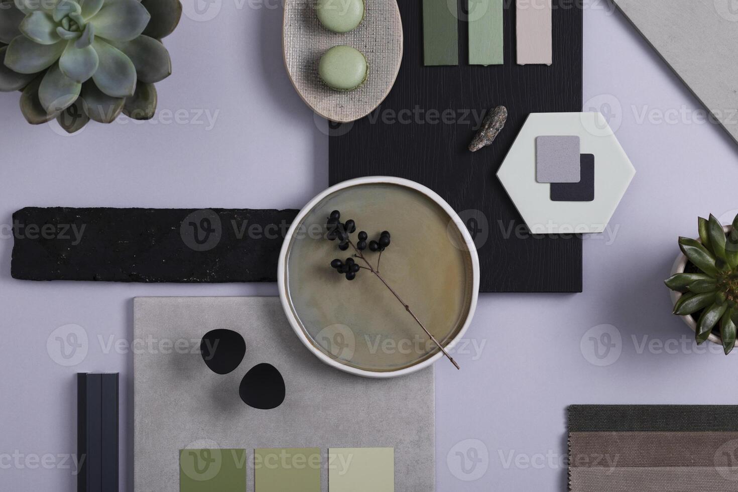 Stylish architect and interior designer moodboard. Flat lay composition in grey and green color palette with textile and paint samples, panels and tiles. Top view. Copy space. Template. photo