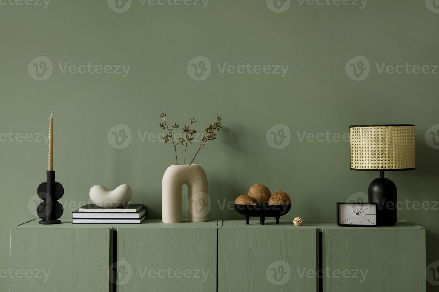 Modern living room interior composition with modern home decorations and personal accessories on the eucalyptus wooden commode. Eucalyptus wall. Template. Copy space. photo