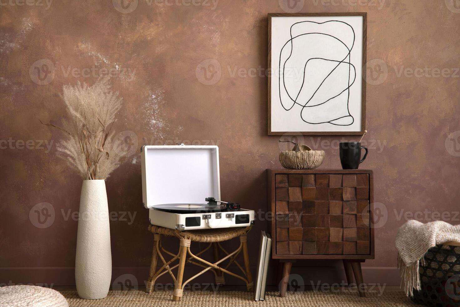 The stylish compostion at living room interior with mock up, design wooden sideboard, gramophone and elegant personal accessories. Brown wall Cozy apartment. Mock up poster. Template. Interior design photo