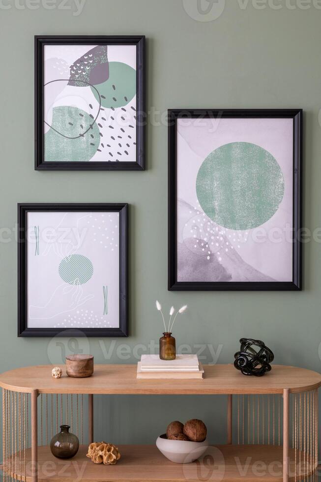 The stylish boho compostion at living room interior with wooden console and elegant personal accessories. Mock up poster. Green wall. Home decor. Template photo