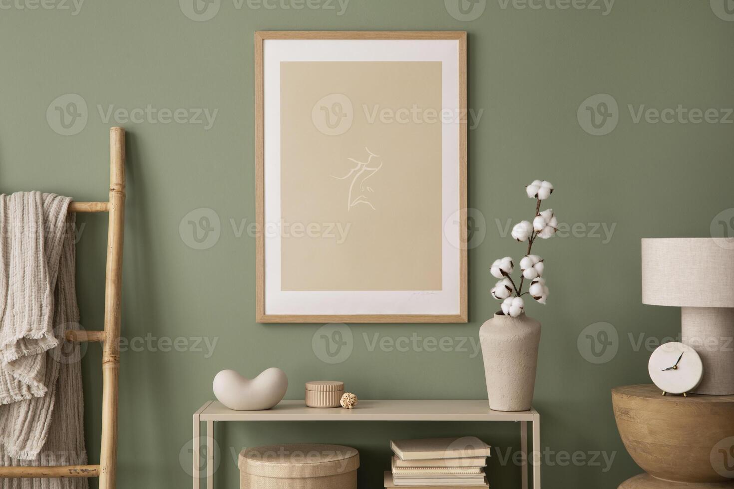 Stylish living room interior design with mock up poster frames, wooden chest of drawers, beige vase and creative home accessories. Sage green wall. Template. photo