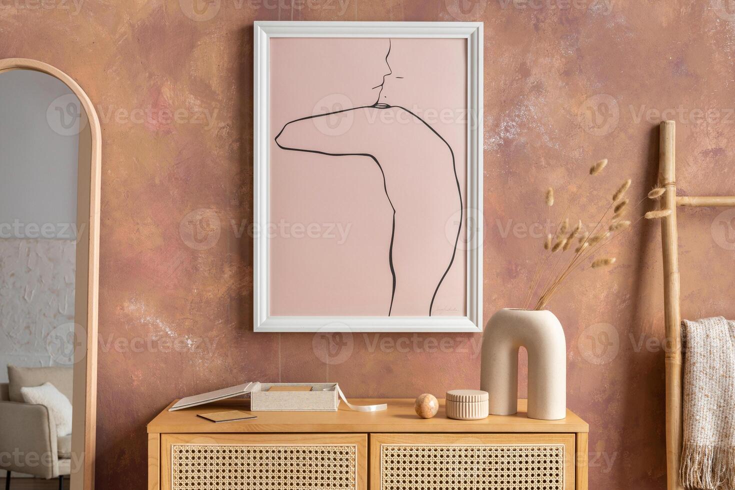 Creative composition vintage living room with rattan chest of drawers, plaid, candlestick with candle, miror and minimalistic poster. Stylish accessories. Mock up poster. Template. photo