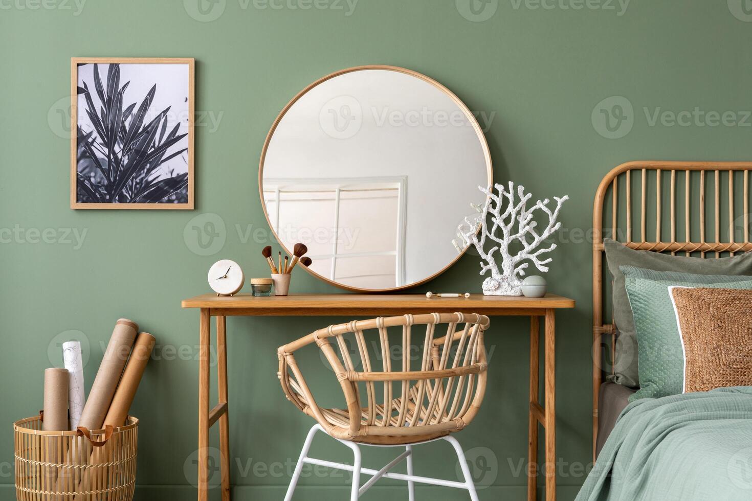 Elegant details of modern interior design with wooden sideboard, bed, mirror, painting and stylish personal accessories. Green wall. Mock up poster. Template. photo