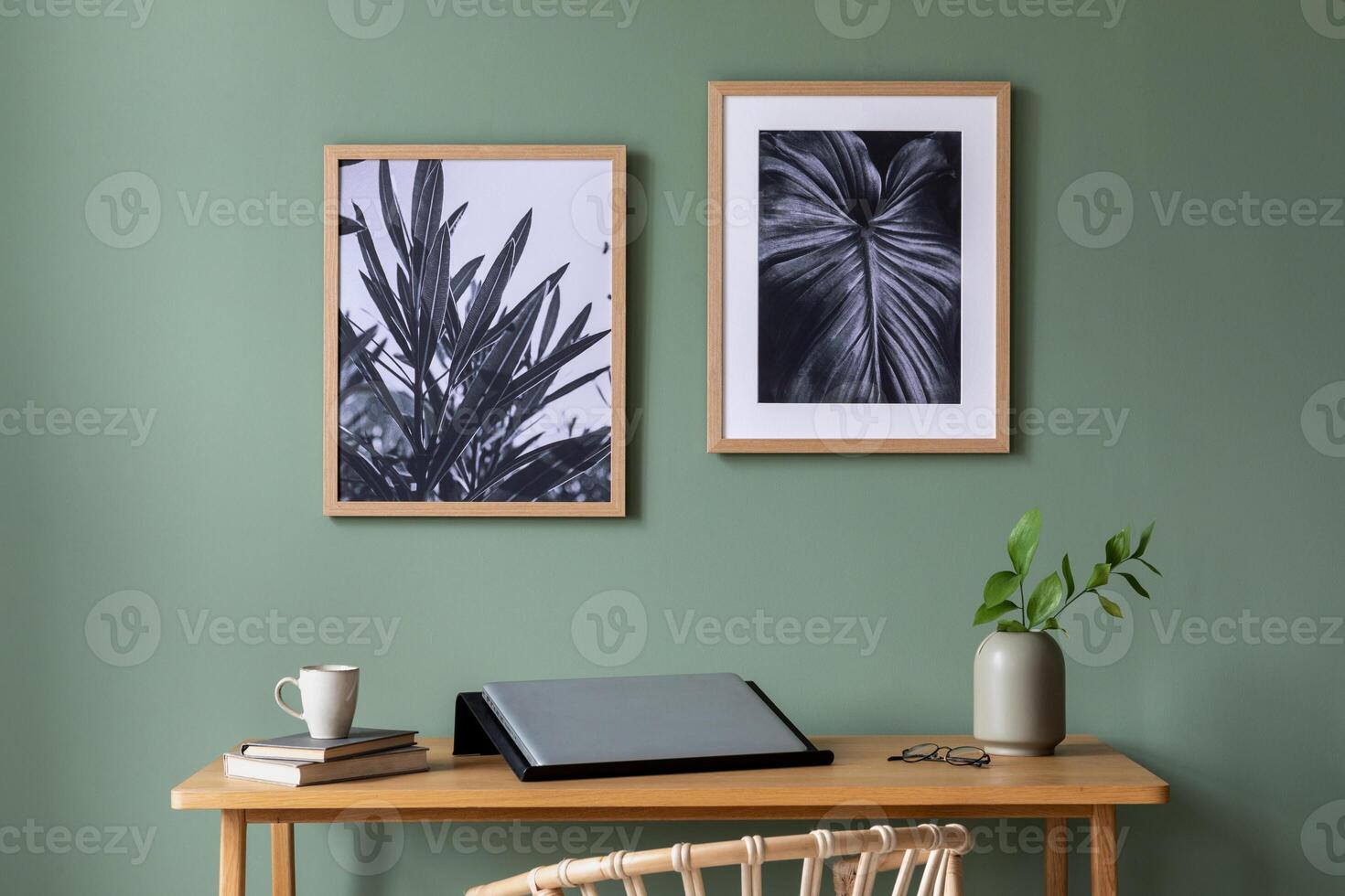 Elegant details of modern interior design with wooden vanity table, round mirror, plant and stylish personal accessories. Black and white posters. Mock up poster. Template. photo
