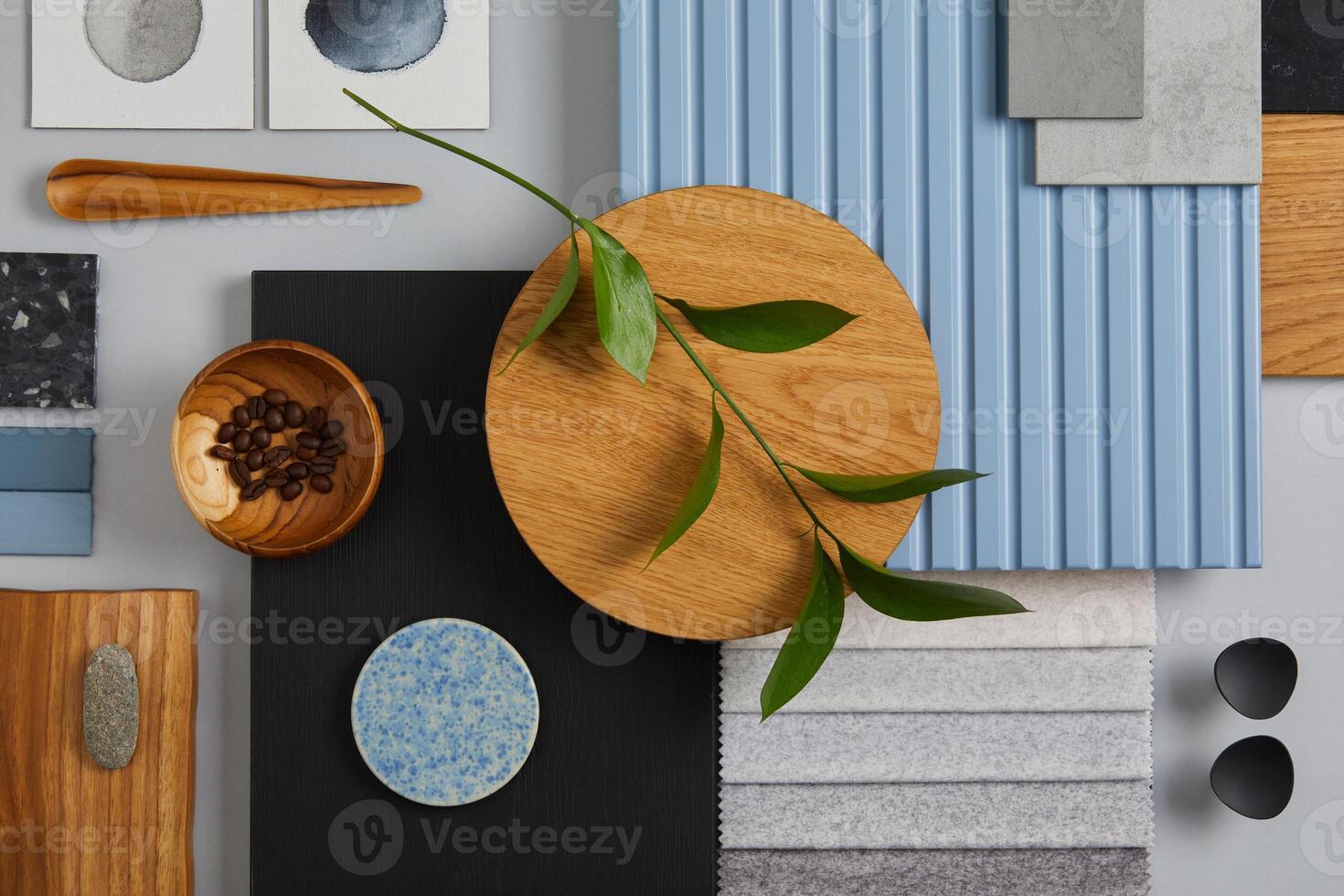 Flat lay of creative architect moodboard composition with samples of wood, textile, paint, lamella panels and tiles. Natural materials. Black, blue and light grey color palette. Copy space. Template. photo