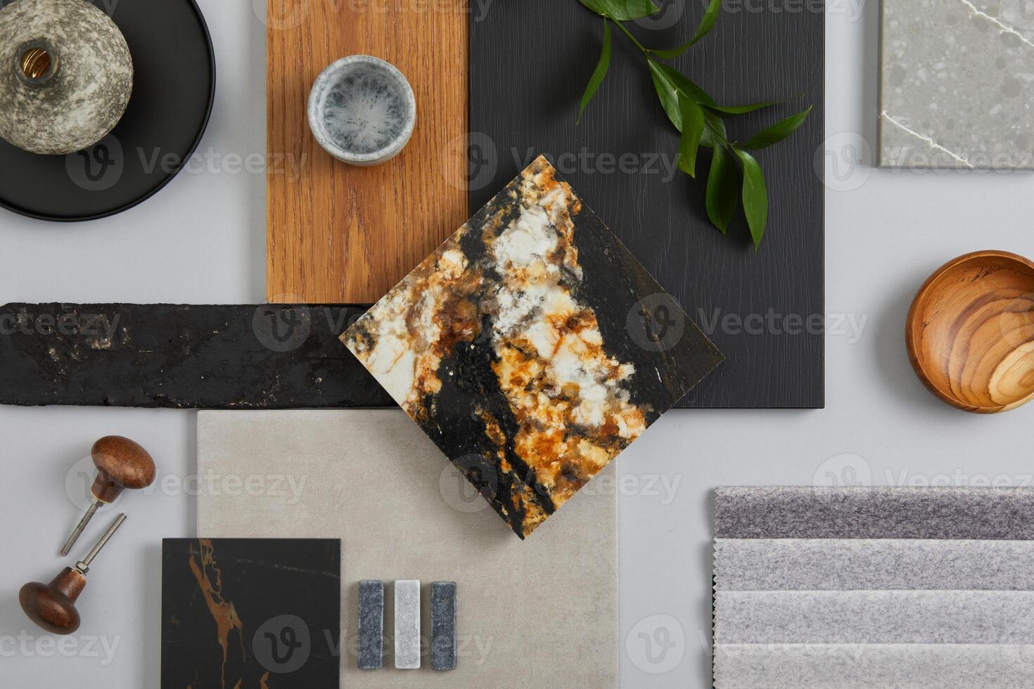 Elegant architect moodboard flat lay composition in light grey, black and brown color palette with textile and paint samples, wooden panels and marble tile. Top view. Copy space. Template. photo