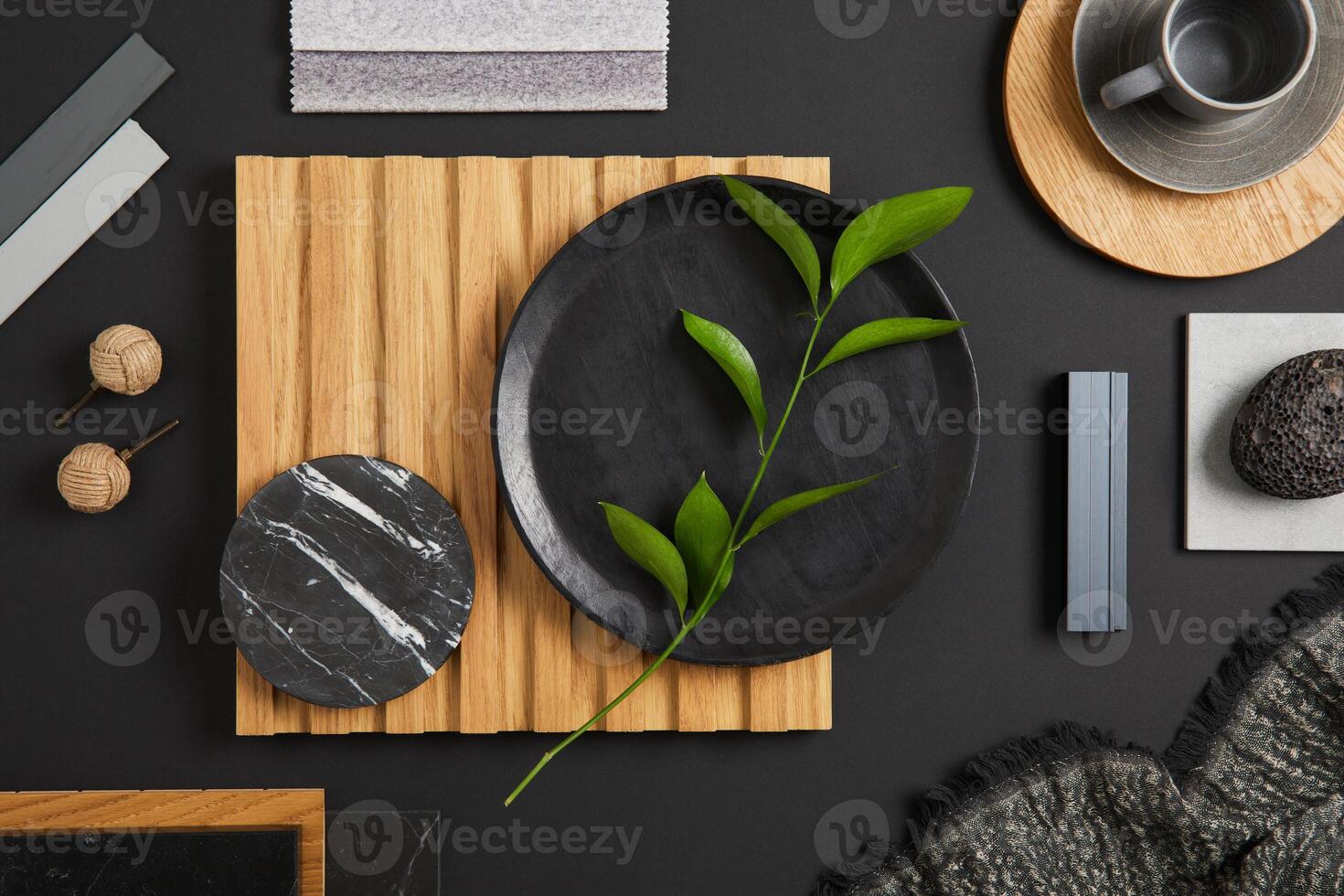 Stylish flat lay comosition of creative architect moodboard with black, beige and grey samples of textile, paint, wooden lamella panels and marble tiles. Top view. Copy space. Template. photo