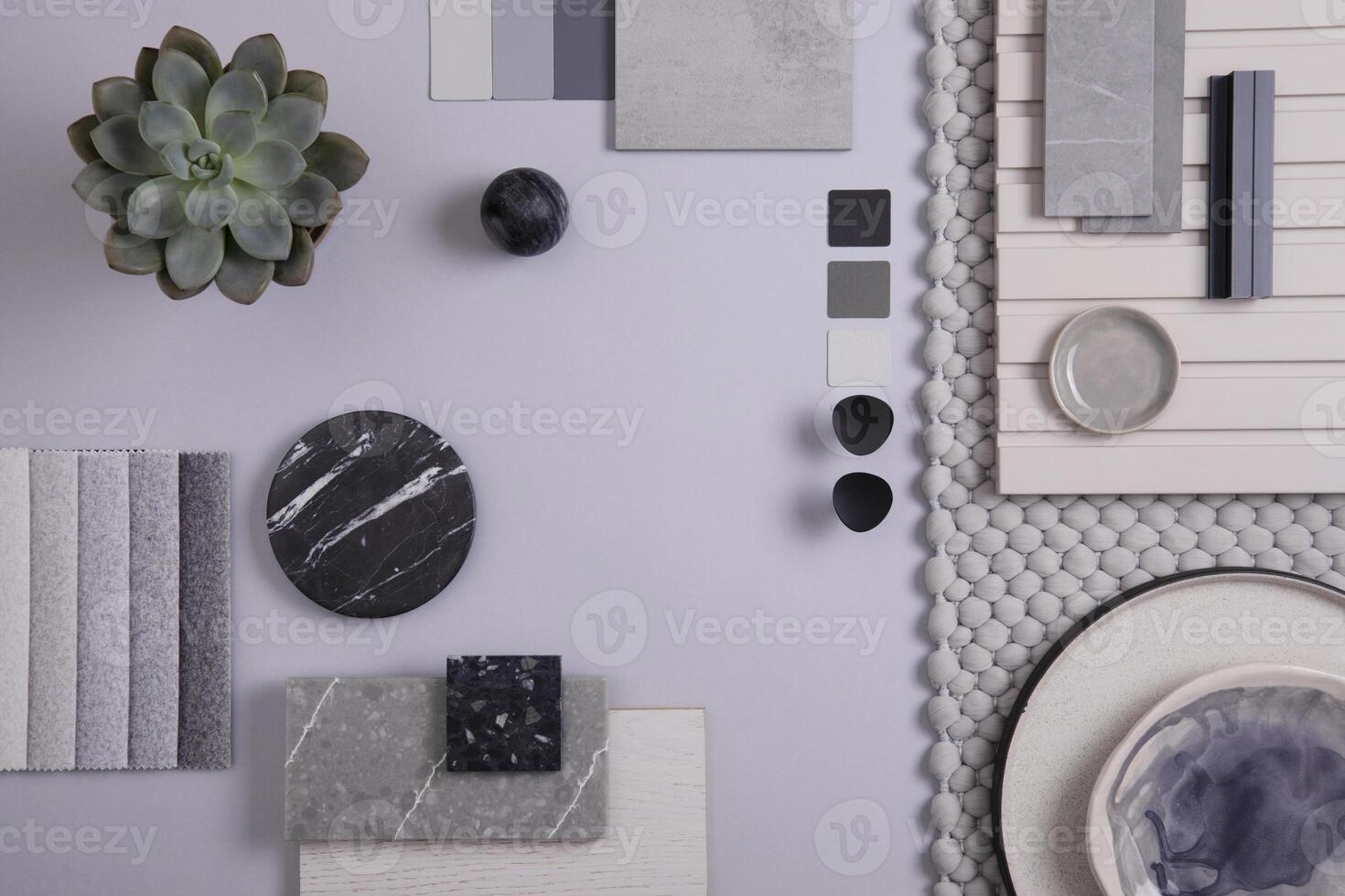 Elegant flat lay composition in grey and black color palette with textile and paint samples, lamella panels and tiles. Architect and interior designer moodboard. Top view. Copy space. photo