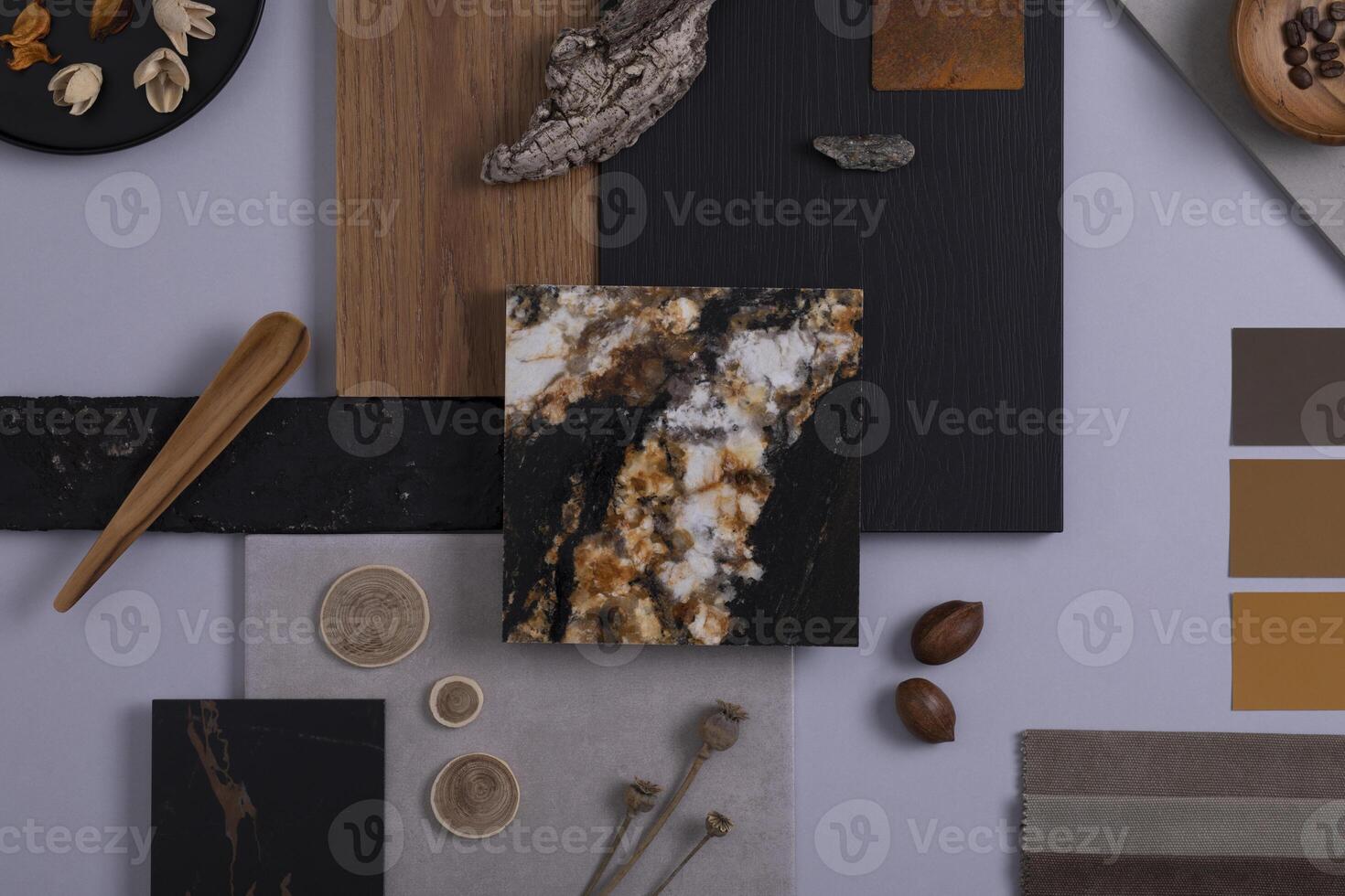 Creative architect moodboard flat lay composition in grey, black and brown color palette with textile and paint samples, wooden panels and marble tile. Top view. Copy space. Template. photo