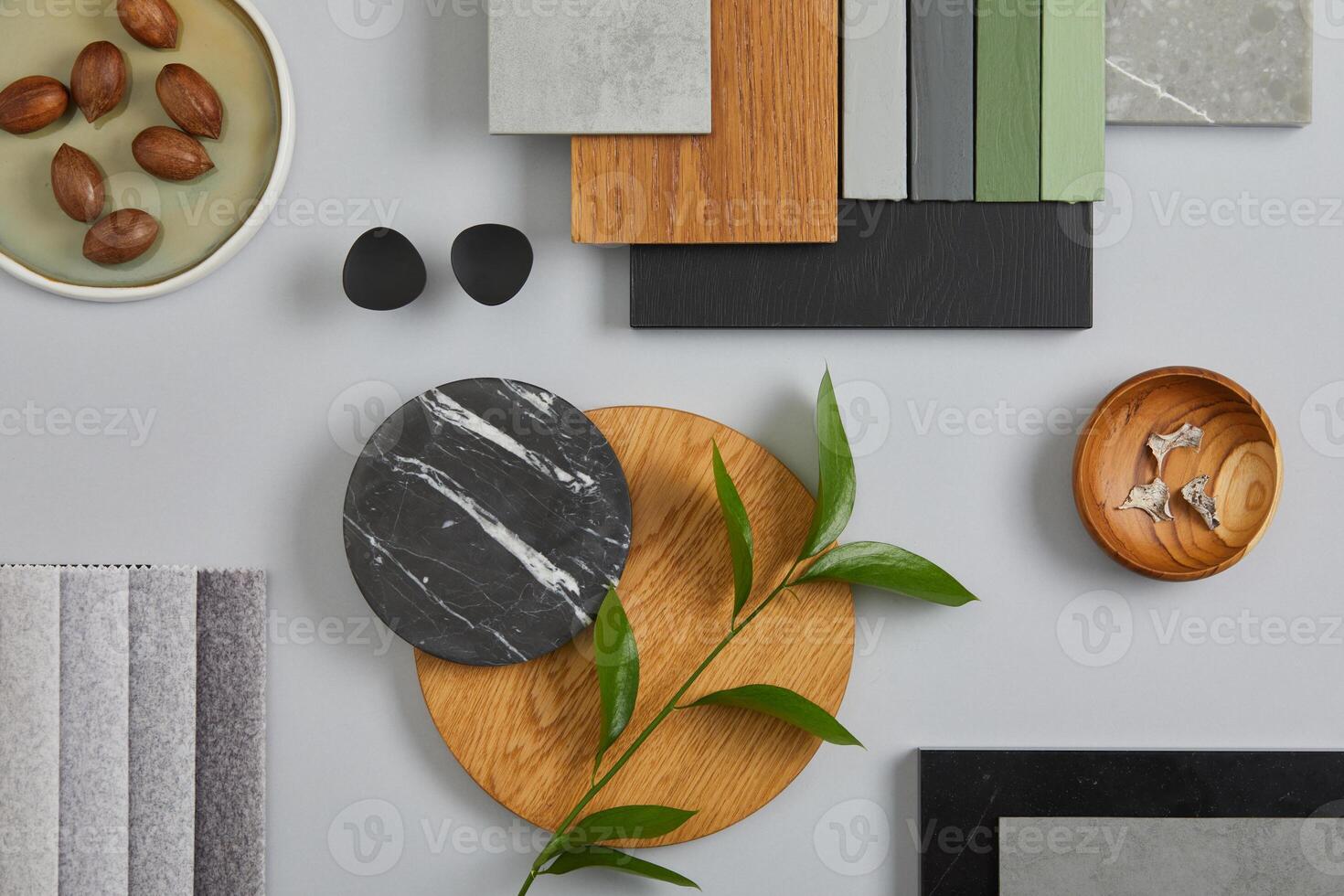 Elegant architect moodboard flat lay composition in light grey, black and brown color palette with textile and paint samples, wooden panels and marble tile. Top view. Copy space. Template. photo