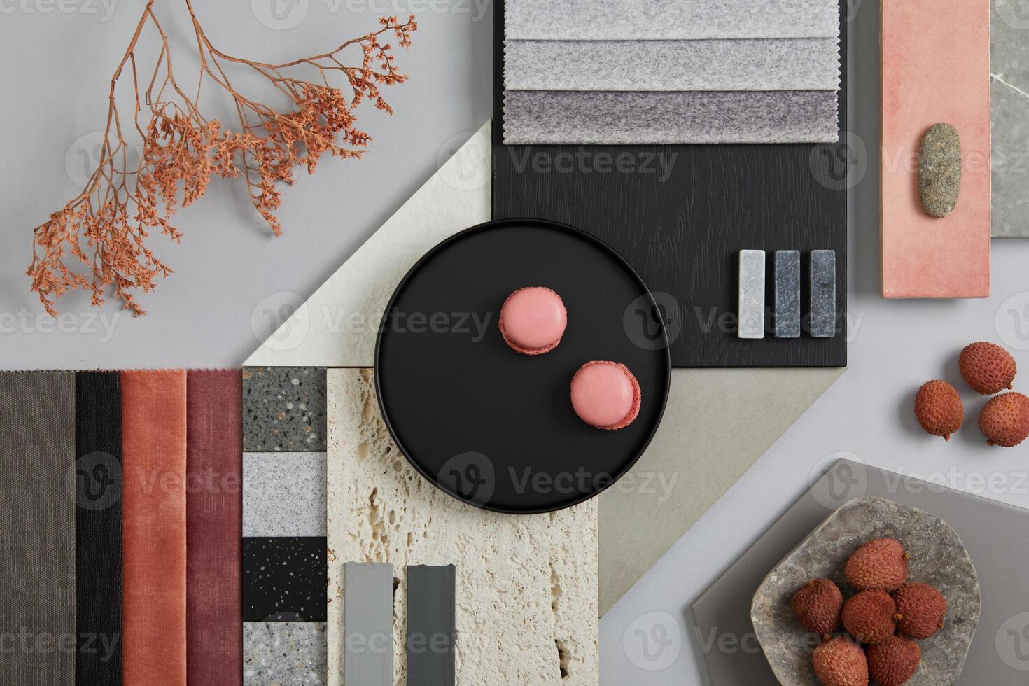 Creative flat lay composition with textile and paint samples, panels and tiles. Stylish interior designer moodboard. Pink, black and light grey color palette. Copy space. Template. photo