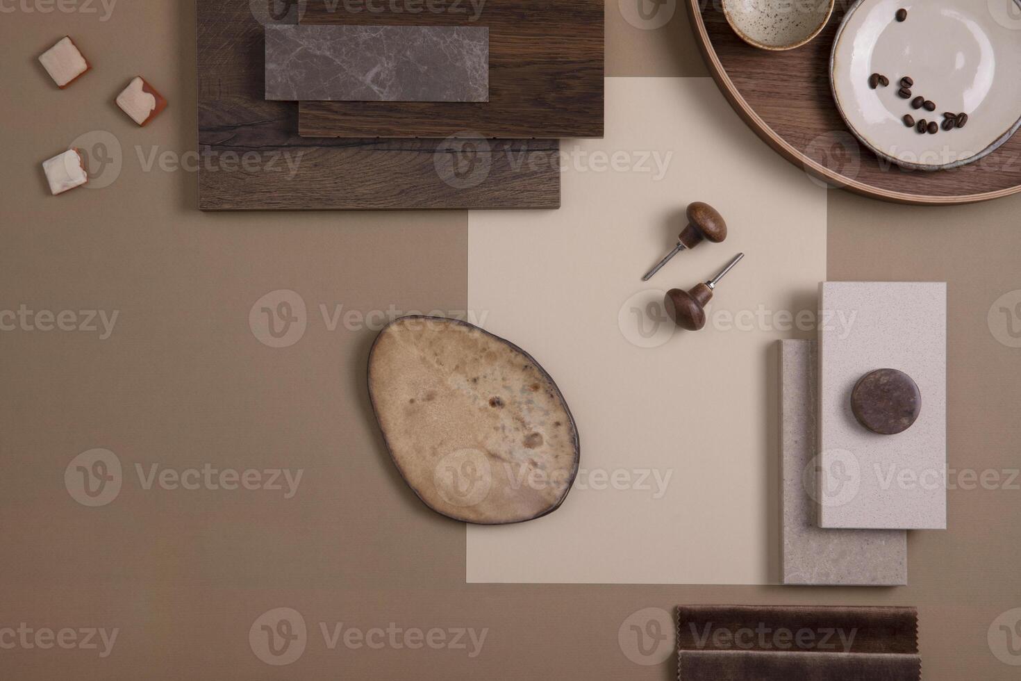 Flat lay of creative architect moodboard composition with samples of textile, paint, panels and tiles. Natural materials. Beige and brown color palette. Top view. Copy space. Template. photo