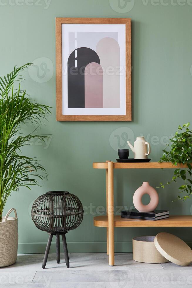 Stylish living room interior design with mock up poster frame, wooden shelf, plants and creative home accessories. Eucalyptus wall. Home staging. Template. Copy space. photo