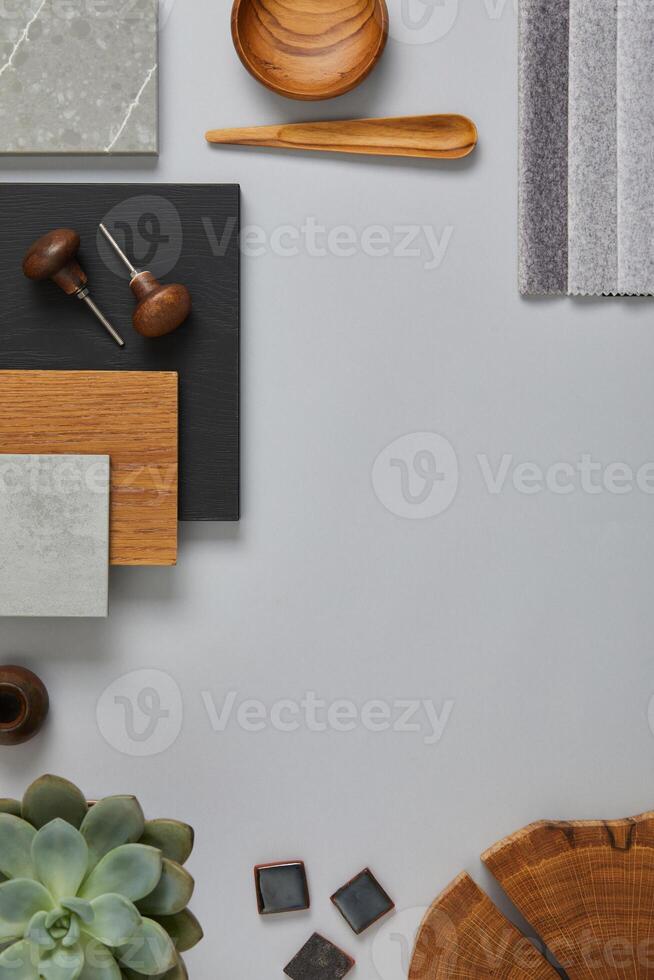 Perfect architect moodboard. Flat lay composition in light grey, black and brown color palette with textile and paint samples, wooden panels and tiles. Top view. Copy space. Template. photo