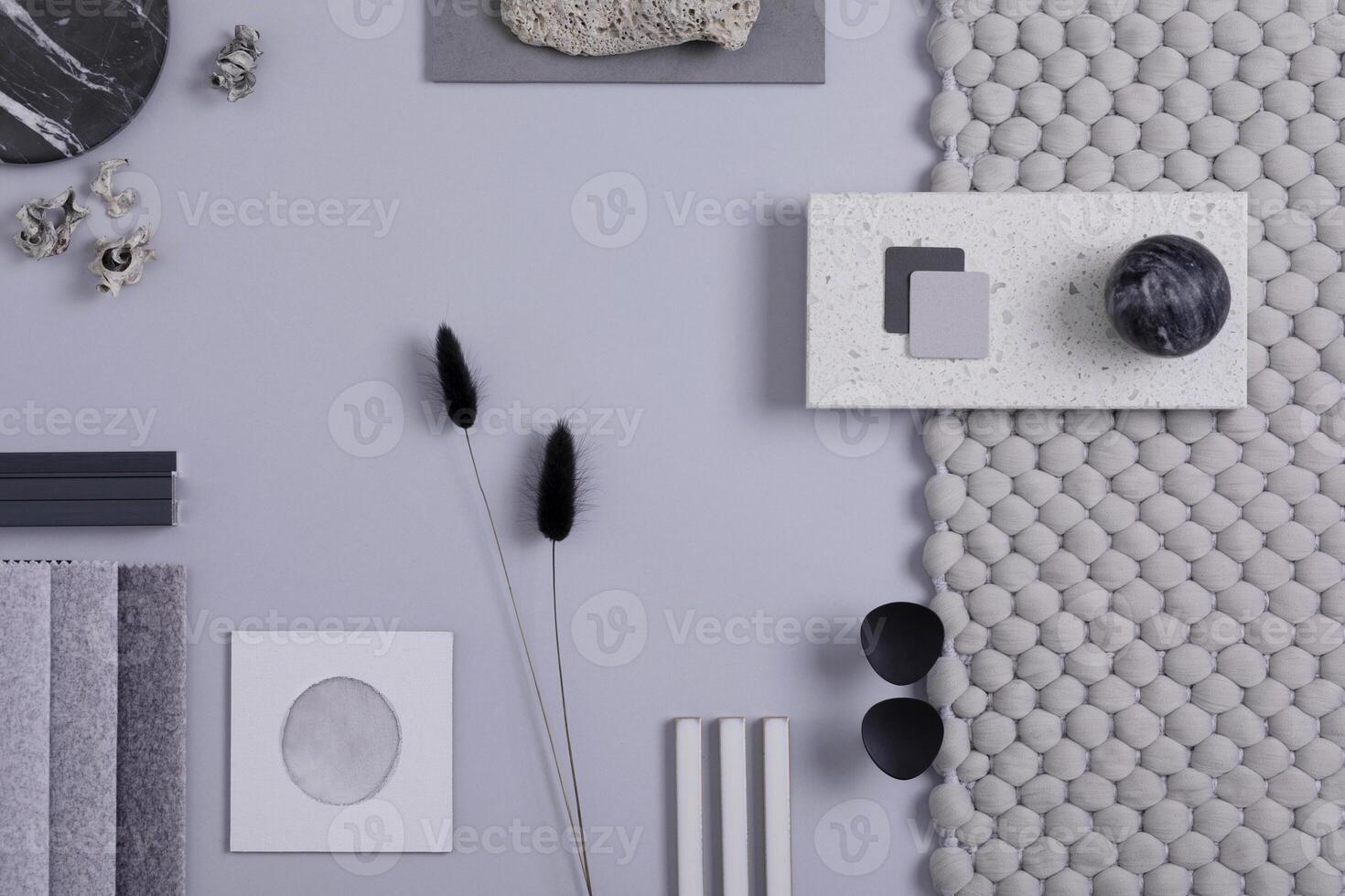 Stylish architect and interior designer moodboard. Flat lay composition in grey color palette with textile and paint samples, panels and tiles. Top view. Copy space. Template. photo