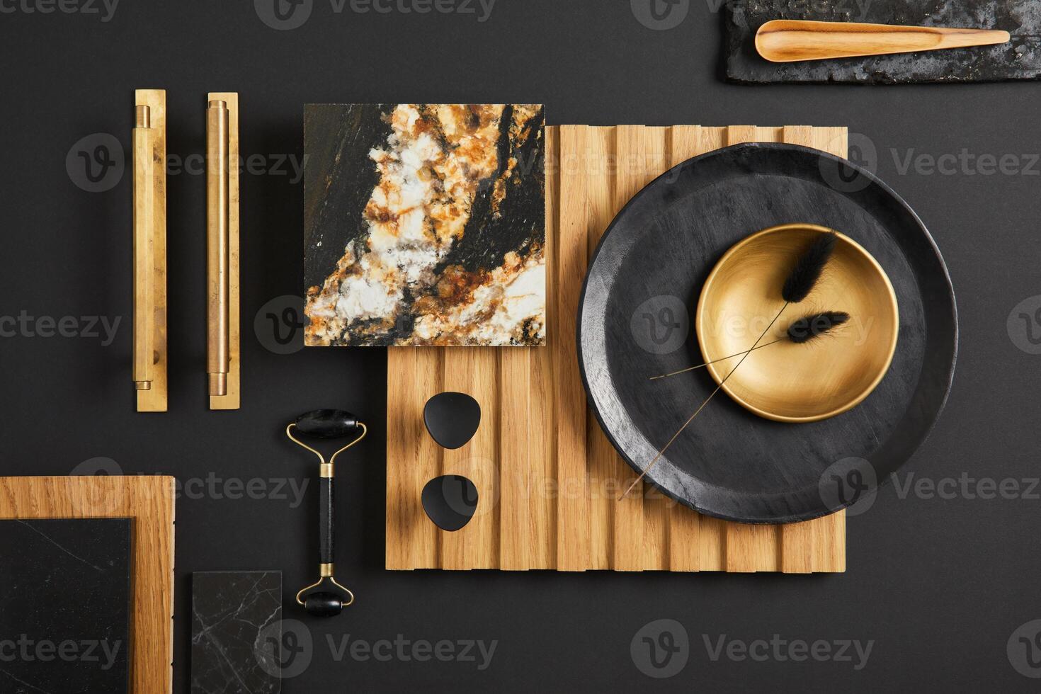 Stylish flat lay comosition of creative architect moodboard with samples of textile, paint, wooden lamella panel and marble tile. Golden, black and beige color palette. Copy space. Template. photo