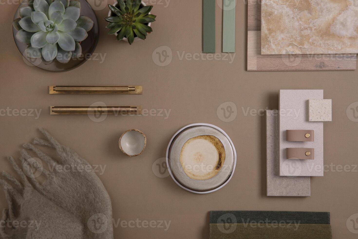 Creative flat lay composition of interior designer moodboard with textile and paint samples, panels and tiles. Beige, brown and green color palette. Copy space. Template. photo