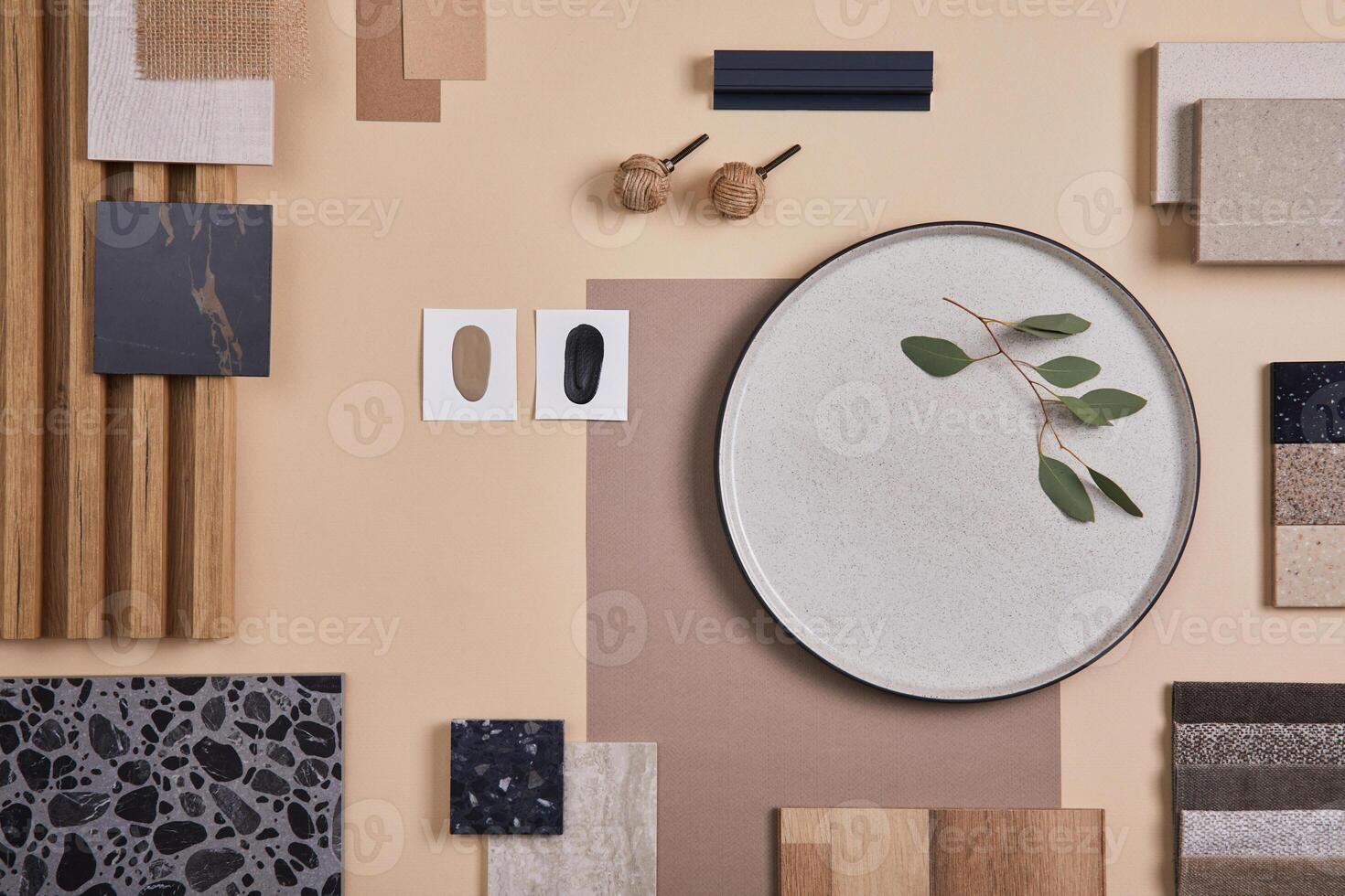 Creative flat lay composition of interior designer and architect moodboard. Textile and paint samples, lamella panels and lastrico tiles. Beige, black and green color palette. Copy space. Template. photo