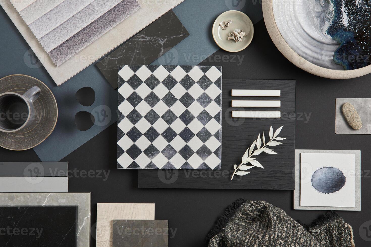 Flat lay of stylish architect moodboard composition with black, beige and grey samples of textile, paint, panels and tiles. Top view. Copy space. Template. photo