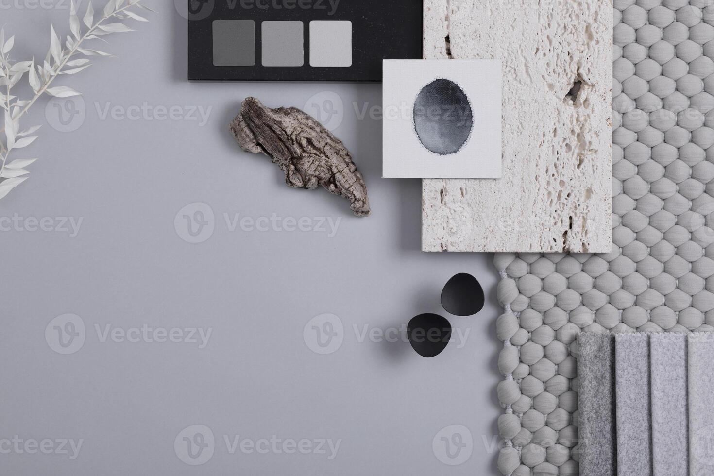 Stylish architect and interior designer moodboard. Flat lay composition in grey color palette with textile and paint samples, panels and tiles. Top view. Copy space. Template. photo