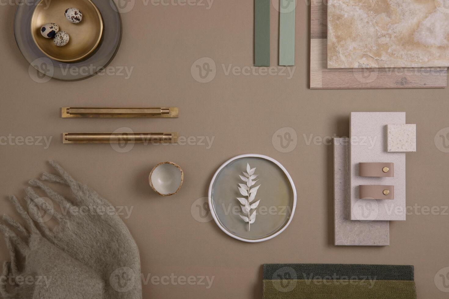 Creative flat lay composition of interior designer moodboard with textile and paint samples, panels and tiles. Beige, brown and green color palette. Copy space. Template. photo