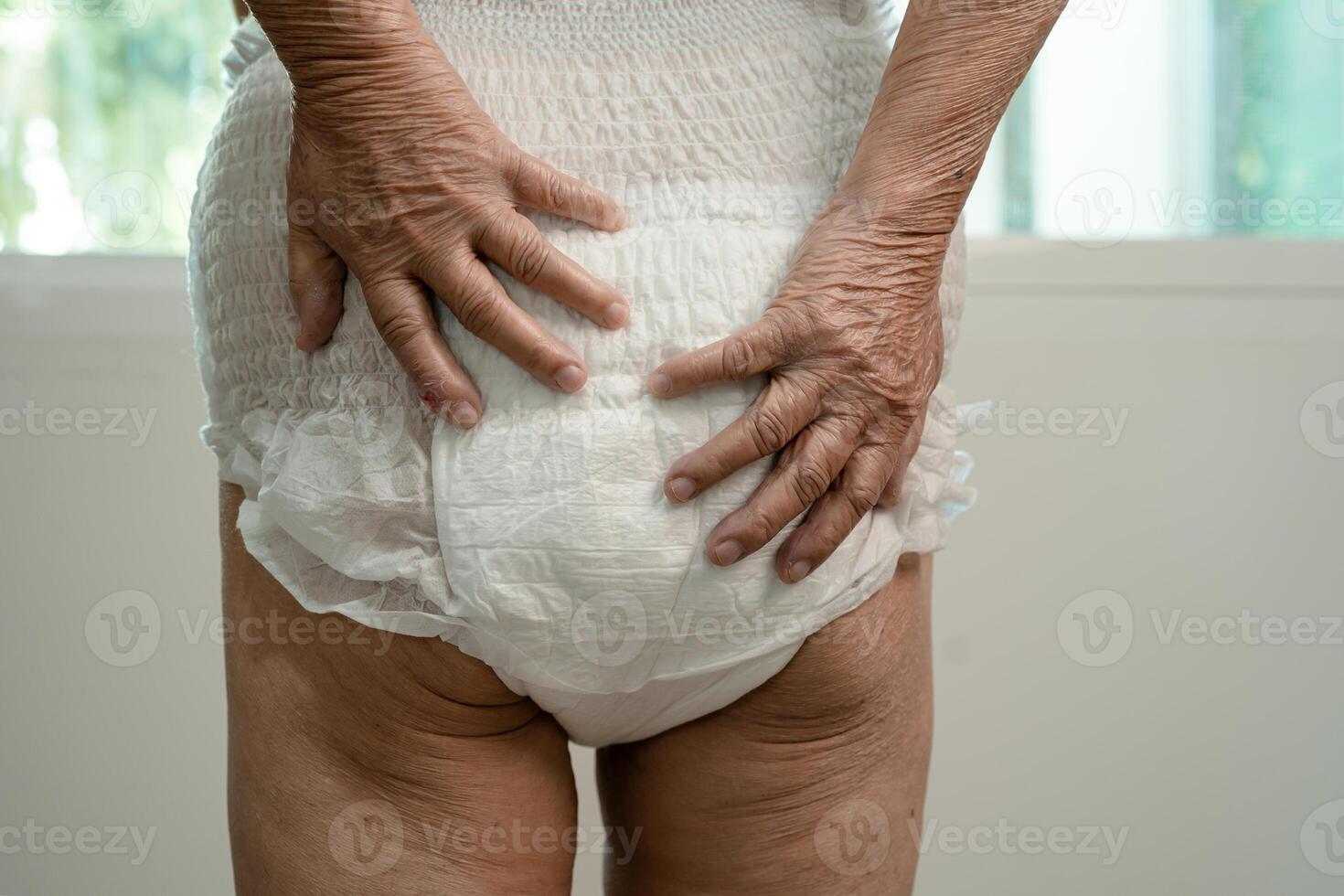 Asian senior woman patient wearing incontinence diaper in hospital, healthy strong medical. photo