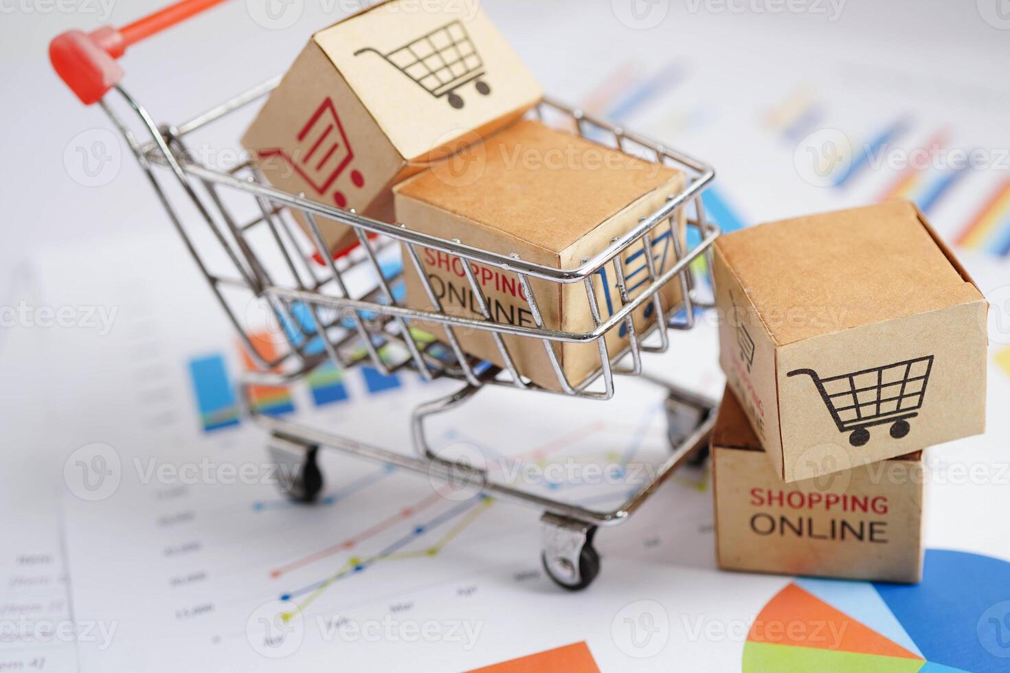 Online shopping, Shopping cart box on business graph, import export, finance commerce. photo