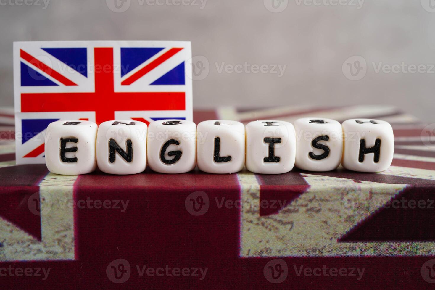 English book with graduate hat, learning and tutorial for foreigner. photo