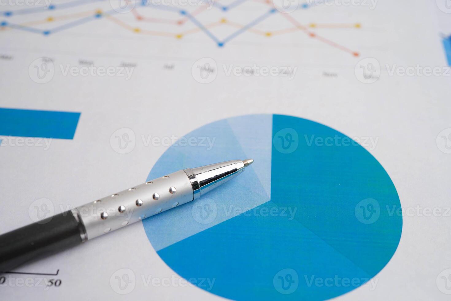 Pen on chart graph paper. Finance, account, statistic, investment data economy, stock exchange business. photo