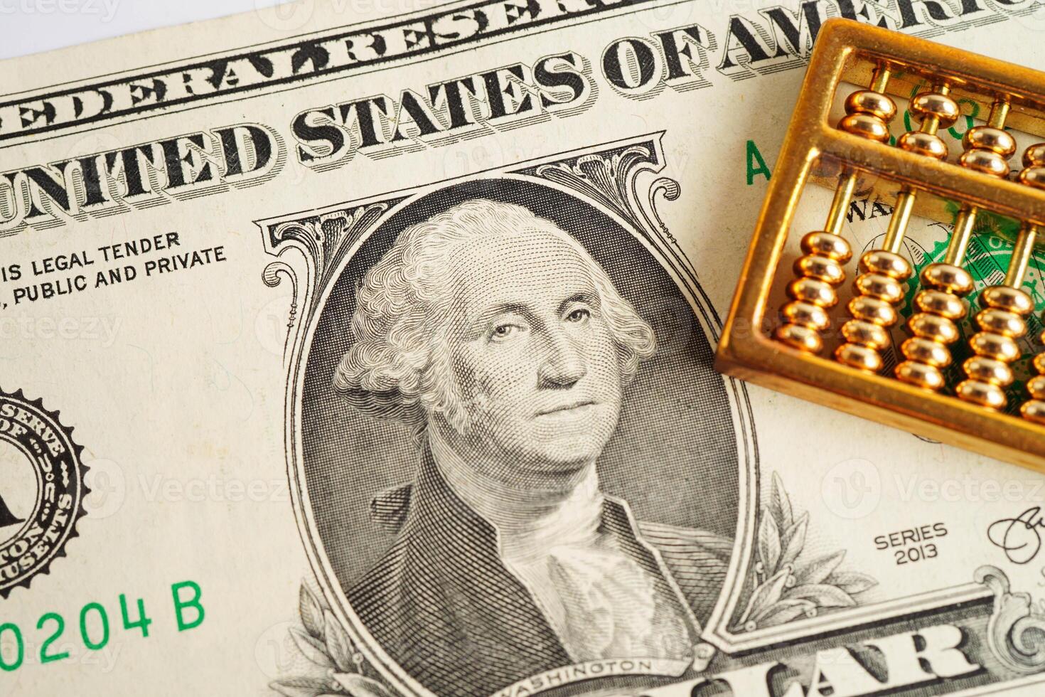 Gold abacus on banknote money, finance trading investment business currency concept. photo